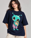 Woman in a navy blue oversized French terry t-shirt printed with an aqua alien hugging a jar of pink clouds and stars
