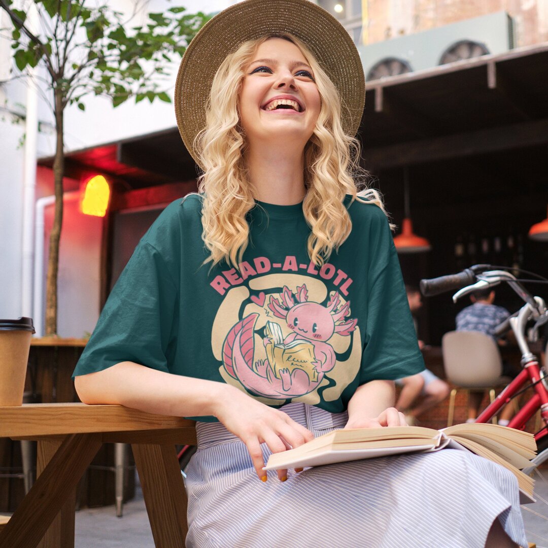 Cute Axolotl Reading oversized tee front graphic – Fourth Dimension Club