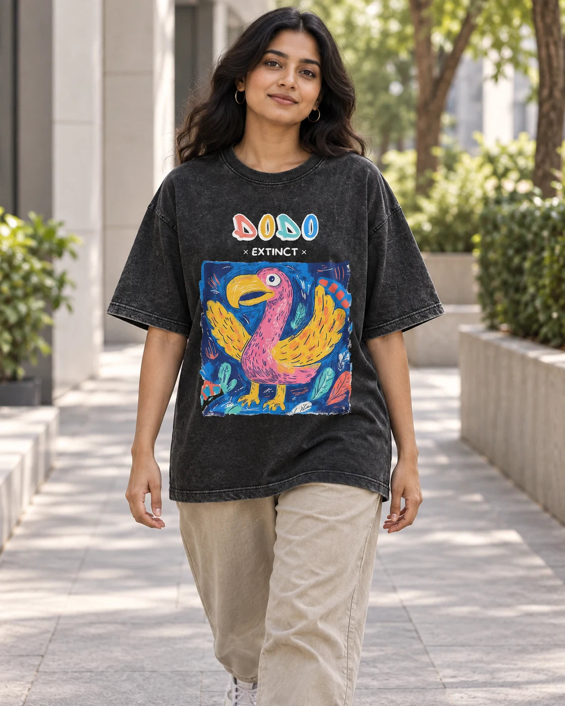 Model wearing the Dodo black acid wash oversized T-shirt on a city street, Fourth Dimension Club
