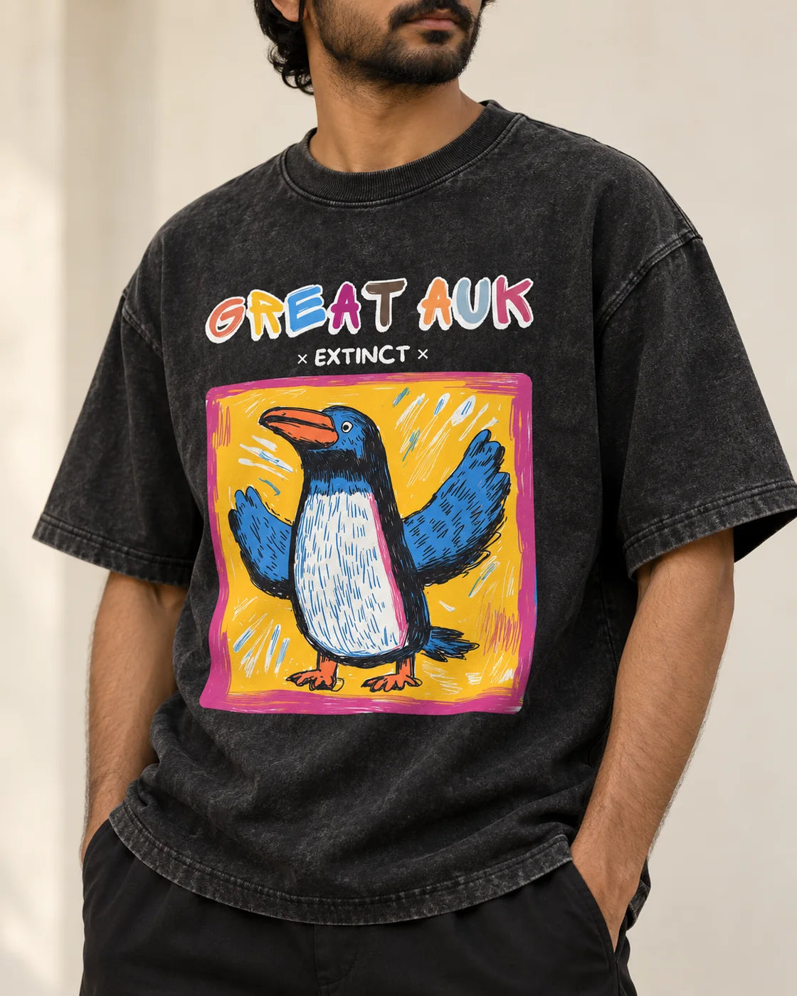 Close-up of the Great Auk Ancient Archives print on a black acid wash oversized T-shirt