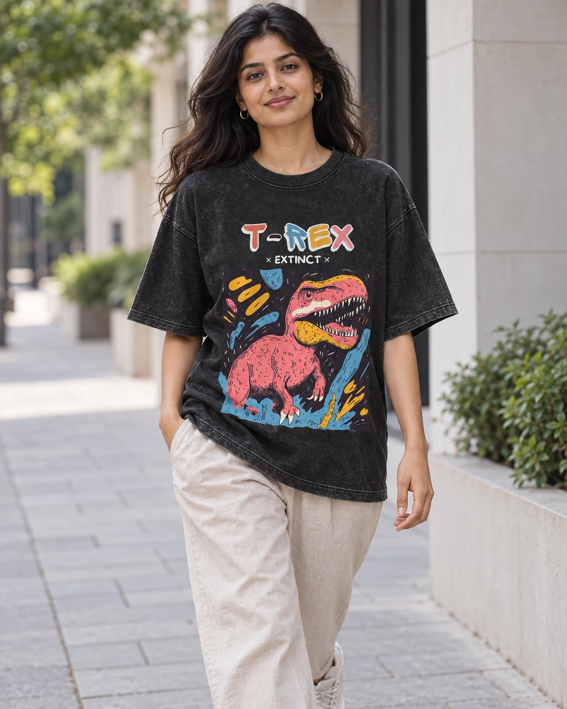 Model wearing the T-Rex black acid wash oversized T-shirt on a city street, Fourth Dimension Club