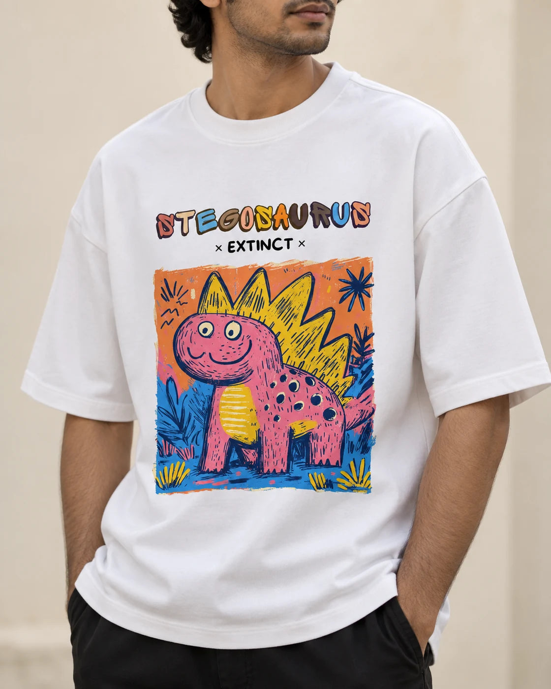 Close-up of the Stegosaurus Ancient Archives print on a white oversized French terry T-shirt
